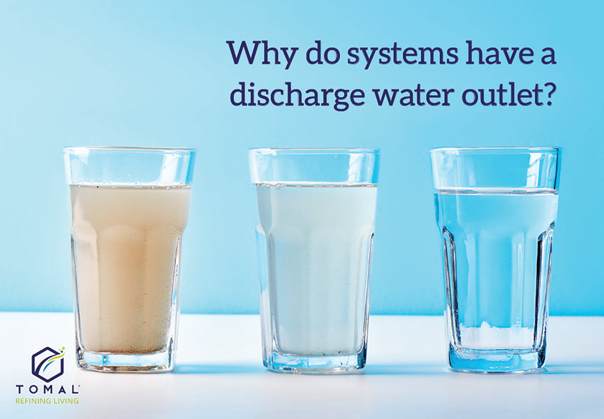 Why do systems have a discharge water outlet?